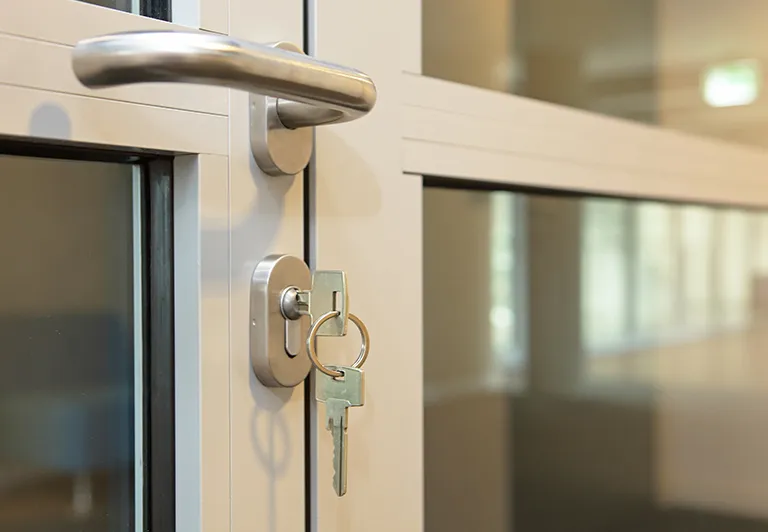 image of a set of keys in a commercial door