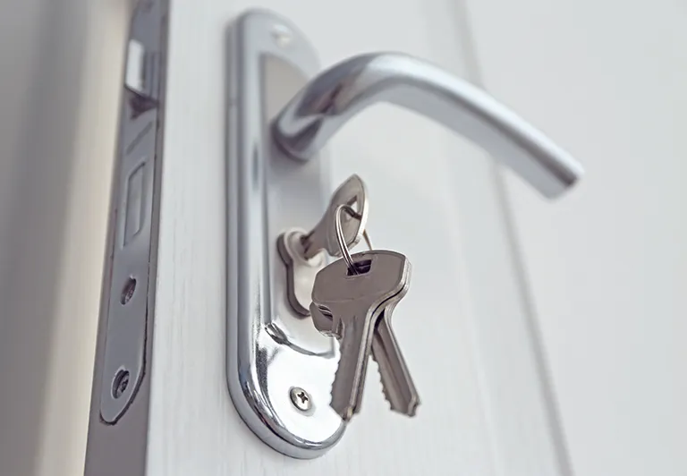 image of a set of keys in a residential door