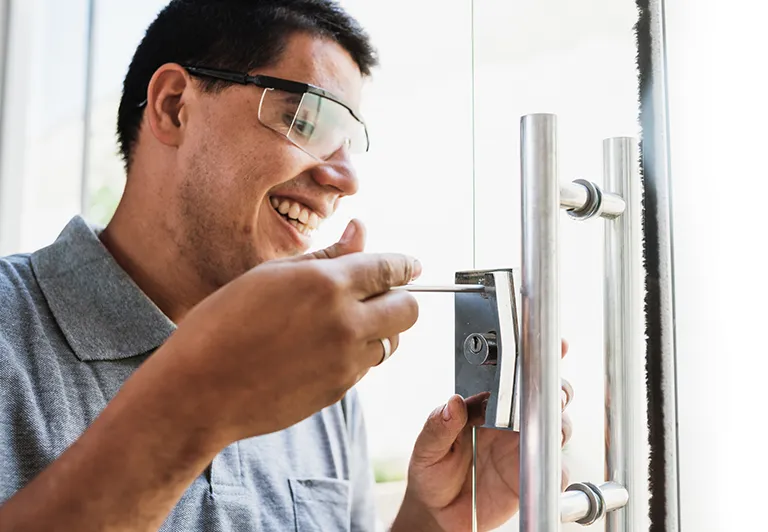 image of a lock smith installing door lock